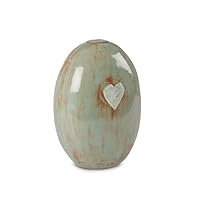 Ceramic cremation urn for ashes with heart sea green | This sea green ceramic cremation urn for human ashes with heart is made in a modern pottery where the craft and love for the work stands central.