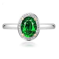 1 Carat oval cut Emerald and Diamond Halo Engagement Ring in White Gold