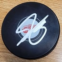 Autographed Shayne Gostisbehere Detroit Red Wings Hockey Puck with COA