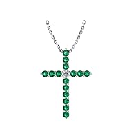 14k White Gold timeless cross pendant set with 15 beautiful green emeralds (.40ct, AA Quality) encompassing 1 sparkling white diamond, (.045 ct, H-I Color, I1 Clarity), dangling on a 18