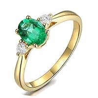 Trilogy Half Carat oval cut Emerald and Round Diamond Engagement Ring in Yellow Gold
