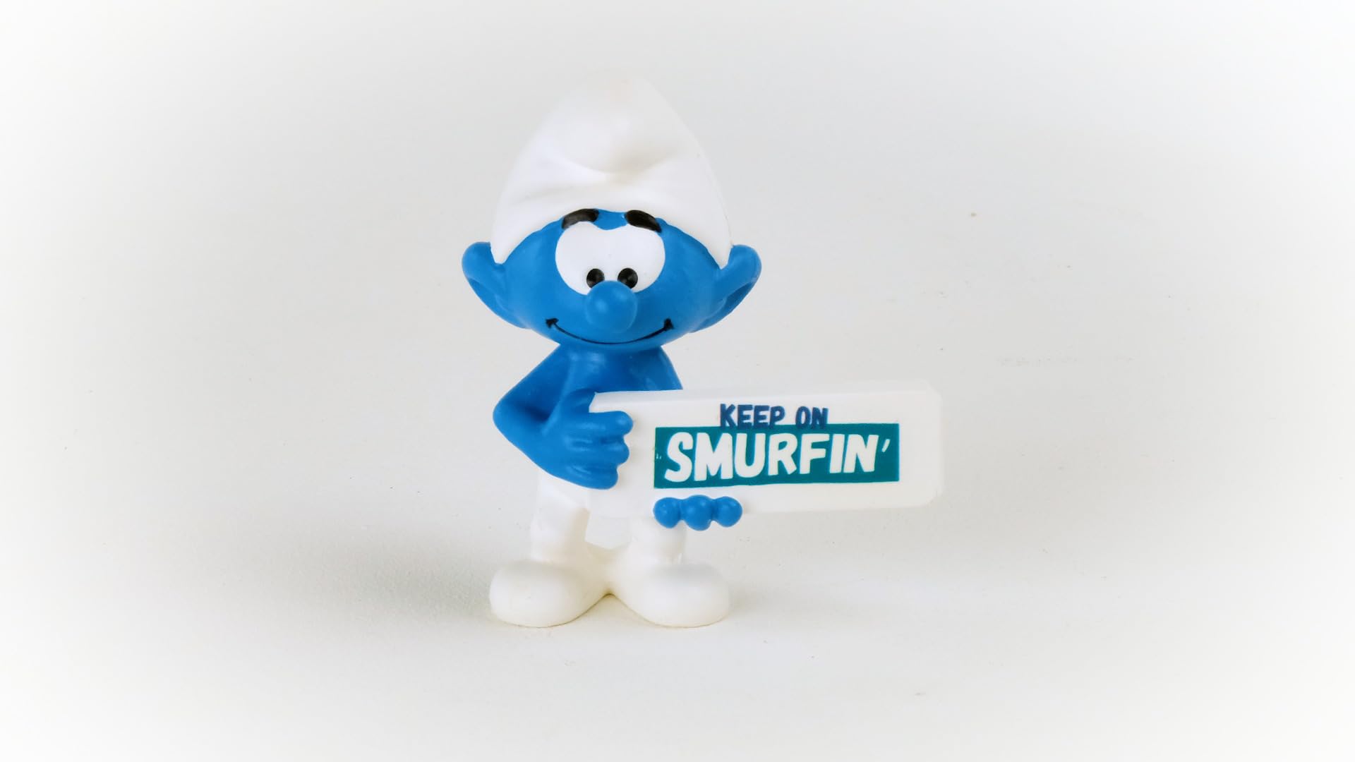 Schleich Smurfs, Collectible Retro Toys and Figurines for All Ages, Smurf Toy Figure Holding Keep on Smurfin' Sign