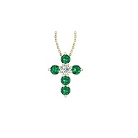 14k Yellow Gold timeless cross pendant set with 5 beautiful green emeralds (.40ct, AA Quality) encompassing 1 white diamond, (.1ct, H-I Color, I1 Clarity), dangling on a 18