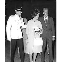 Vintage photo of Princess Sofia and Prince Juan Carlos of Spain smiling ang walking with another man.