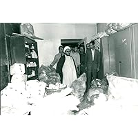 Vintage photo of Sadegh Khalkhali displays seized opium and heroin