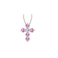 14k Rose Gold timeless cross pendant set with 5 resilient pink sapphires (.47ct, AA Quality) encompassing 1 round white diamond, (.1ct, H-I Color, I1 Clarity), hanging on a 18