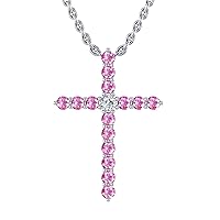 14k White Gold timeless cross pendant set with 15 resilient pink sapphires (1/4ct, AA Quality) encompassing 1 round white diamond, (.025ct, H-I Color, I1 Clarity), hanging on a 18
