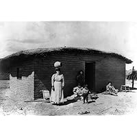 Pima Family C1900 Na Pima Indian Family Including A Woman With A Piece Of Pottery On Her Head Photographed Outside An Adobe House In Arizona C1900 Poster Print by (18 x 24)
