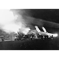 Anti-aircraft gun Fort Shafter Hawaii fires at night as the artillery lights up the sky like fireworks Poster Print (24 x 36)