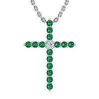 14k White Gold timeless cross pendant set with 15 beautiful green emeralds (.225ct, AA Quality) encompassing 1 round white diamond, (.025ct, H-I Color, I1 Clarity), dangling on a 18