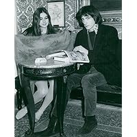 Vintage photo of Romina Power and Stash Klossowski De Rola sitting.