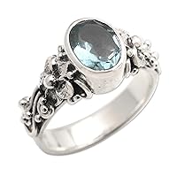 NOVICA Artisan Handmade Blue Topaz Single Stone Ring Oval Cut Silver with Floral Design Sterling Cocktail Indonesia Serenity Birthstone 'Frangipani Path'