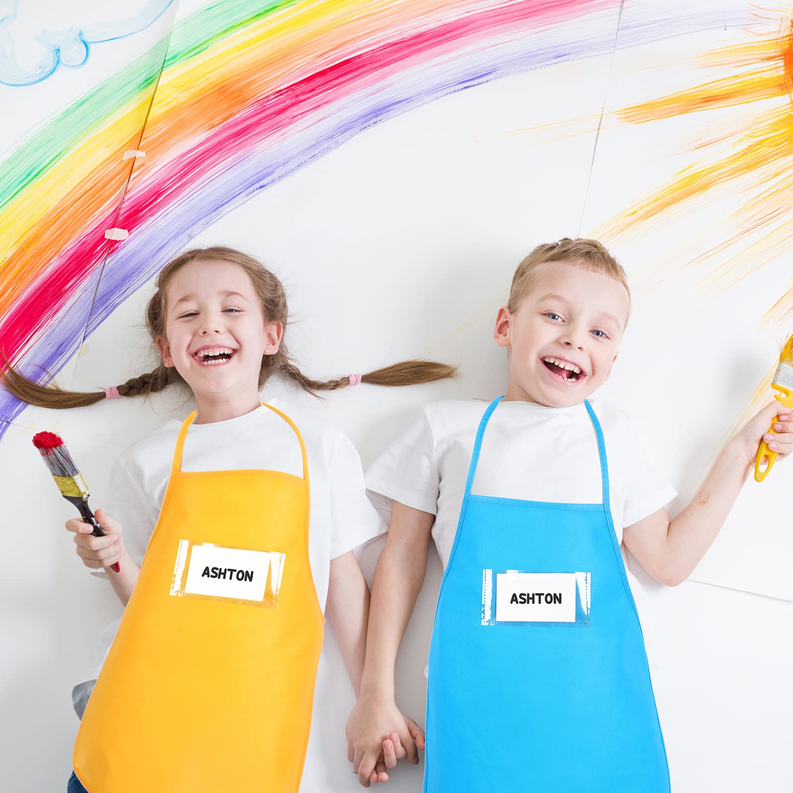 Shihanee 24 Pieces Artists Fabric Aprons with Pockets Kids Apron Bulk Toddler Art Smock Paint Apron for Kids Classroom, Crafts Painting Activity, Kitchen Community Event, Birthday Supplies, 12 Colors