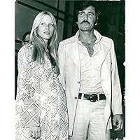 Vintage photo of George Lazenby, actor from Australia with Christina Gannett.