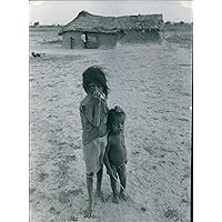 Vintage photo of Two young malnourished children in India.