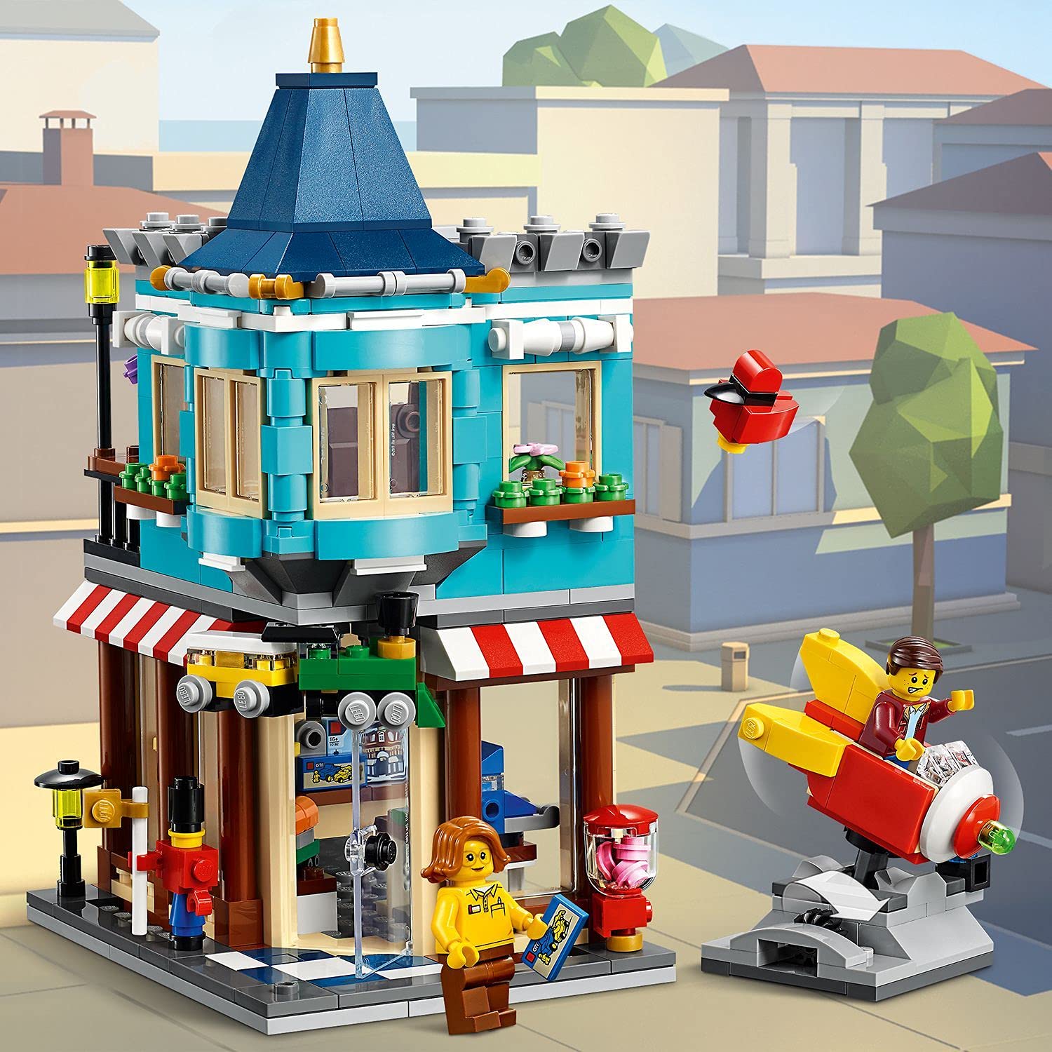LEGO 31105 Creator 3-in-1 Townhouse Toy Store - Cake Shop - Florist Building Set, with Flowers and Working Rocket Ride, for Kids 8+ Years Old