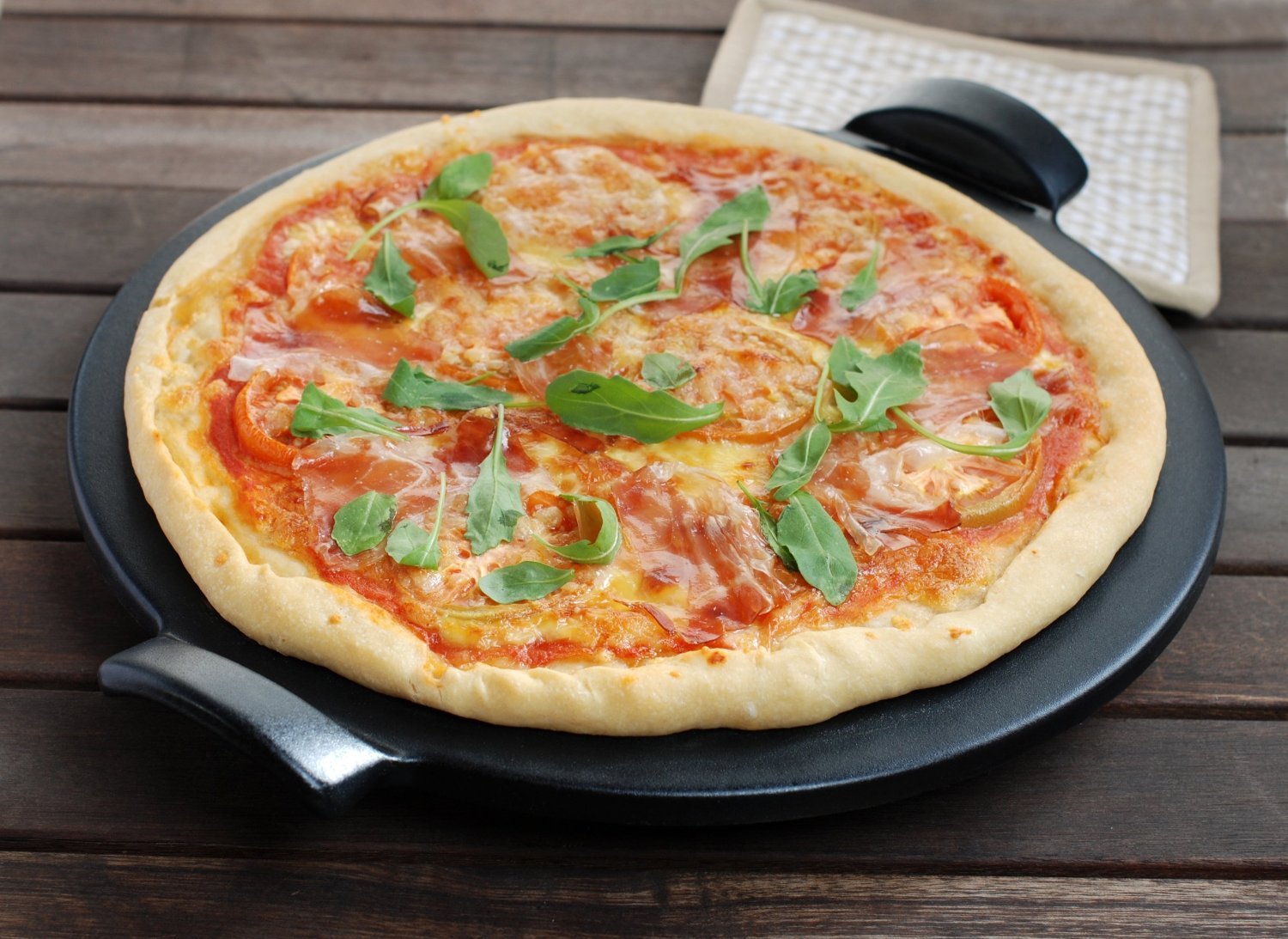 Emile Henry Made in France Flame Top Pizza Stone, Black. Perfect for Pizzas or Breads. In the Oven, On Top of the BBQ. Safe up to 750 degrees F. 100% Natural Clay, Glazed Surface. Easy to Clean.