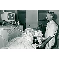 Vintage photo of Hospitals ambulances and equipment: kevin barrs watches his kidney stone being shattered by danish medical student.
