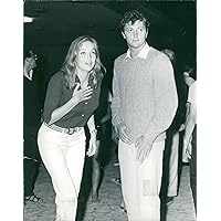Vintage photo of Mia Genberg standing beside Jim Mitchum.