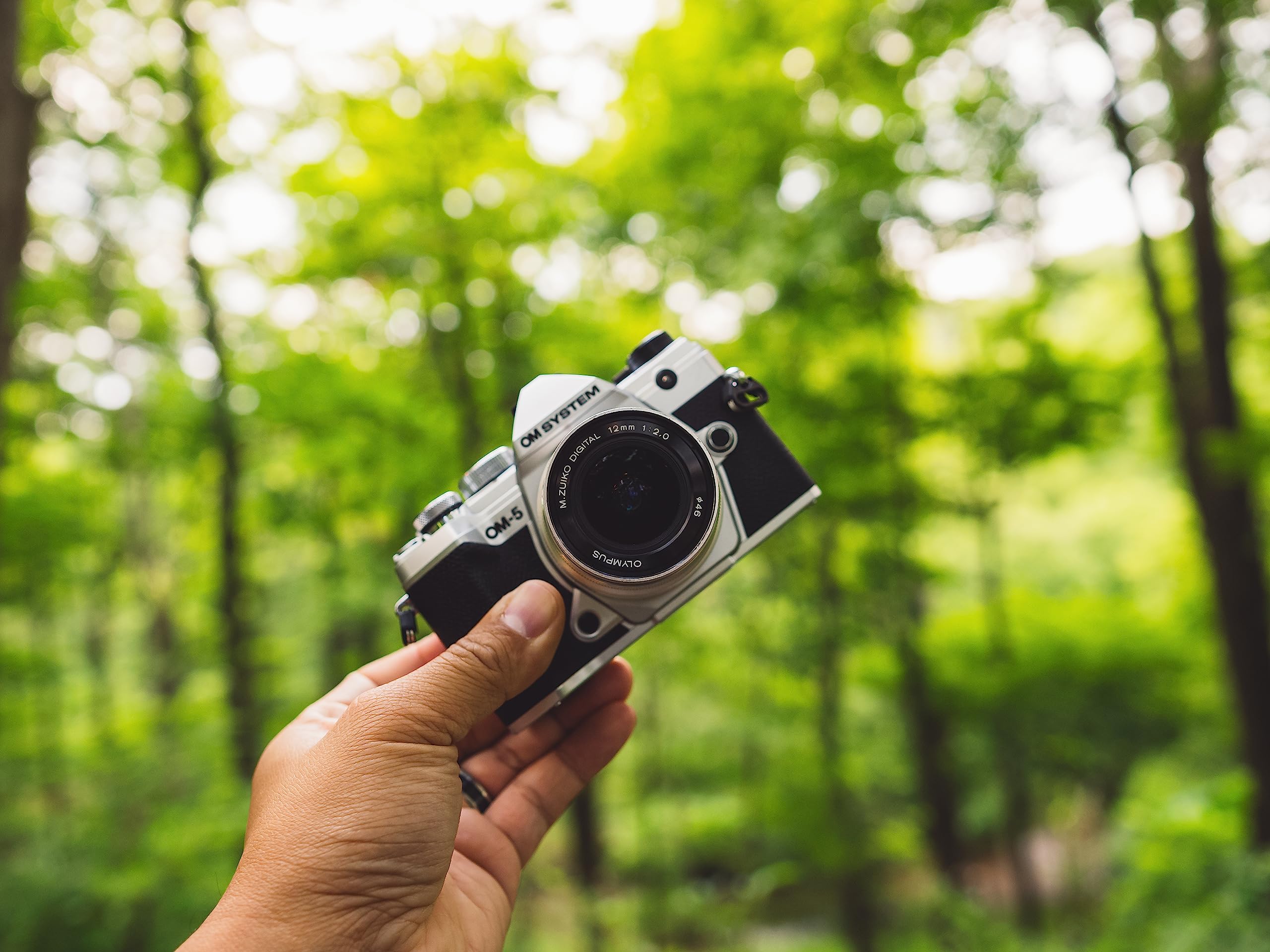 Bundle of OM System OM-5 Silver Outdoor Camera Weather Sealed Design 5-Axis Image Stabilization 50MP Handheld High Res Shot + M.Zuiko Digital ED 12mm F2.0 Silver